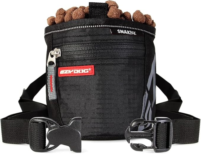 A black bag with food in it and two buckles.